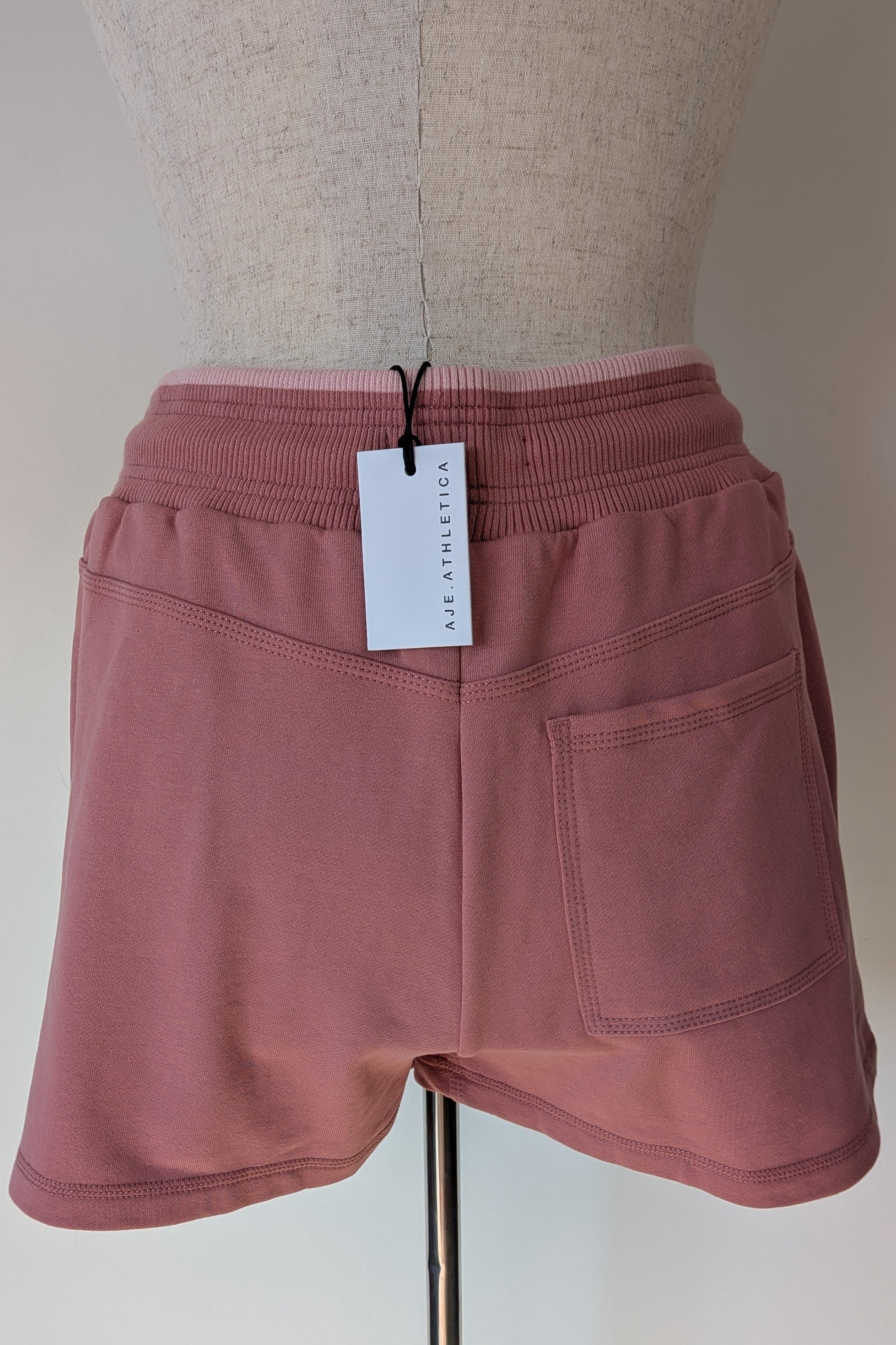 Aje Athletica Signature Logo Sweat Shorts in Rose Quartz Size 16 BNWT RRP $115